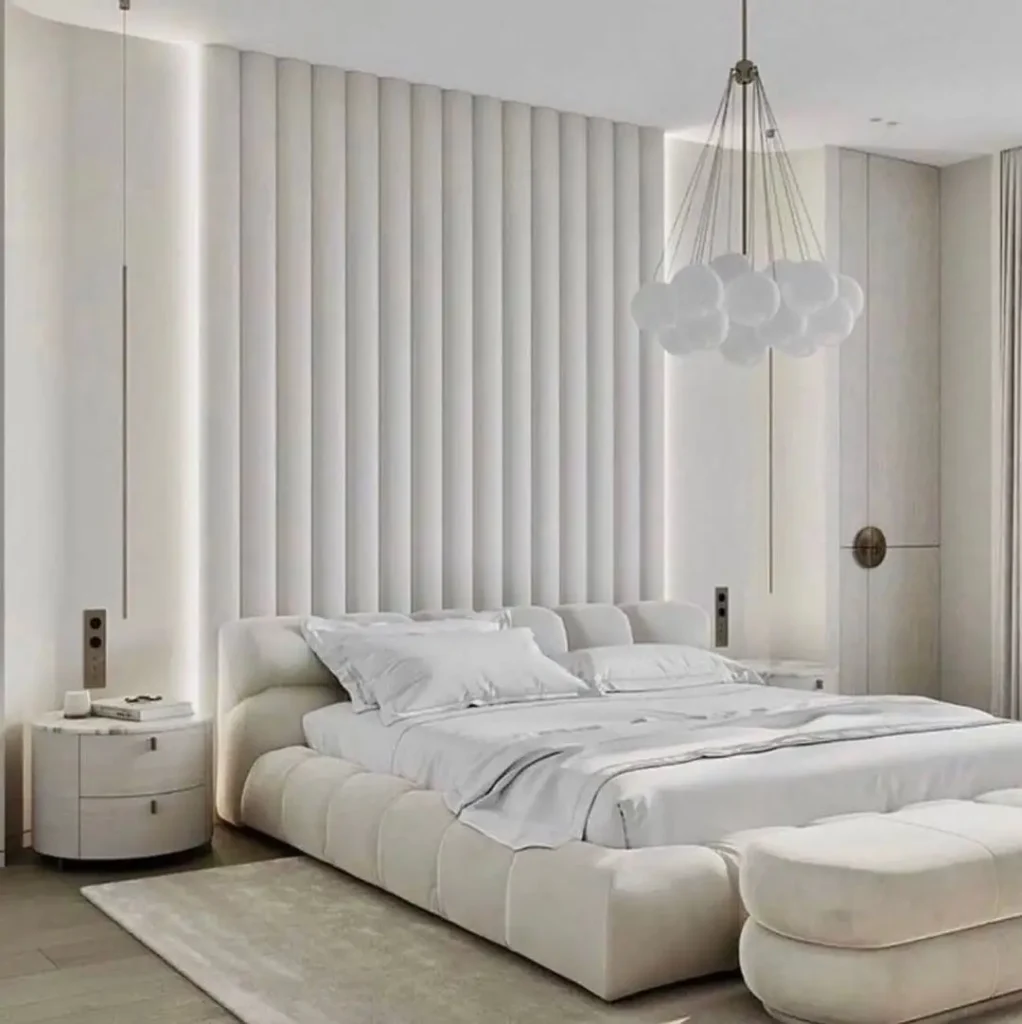 Bright modern luxury bedroom with large windows and neutral decor