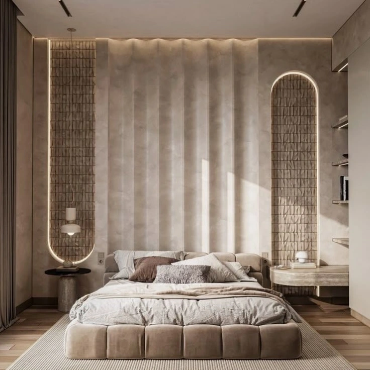 Elegant bedroom with curved upholstered headboard and soft decor