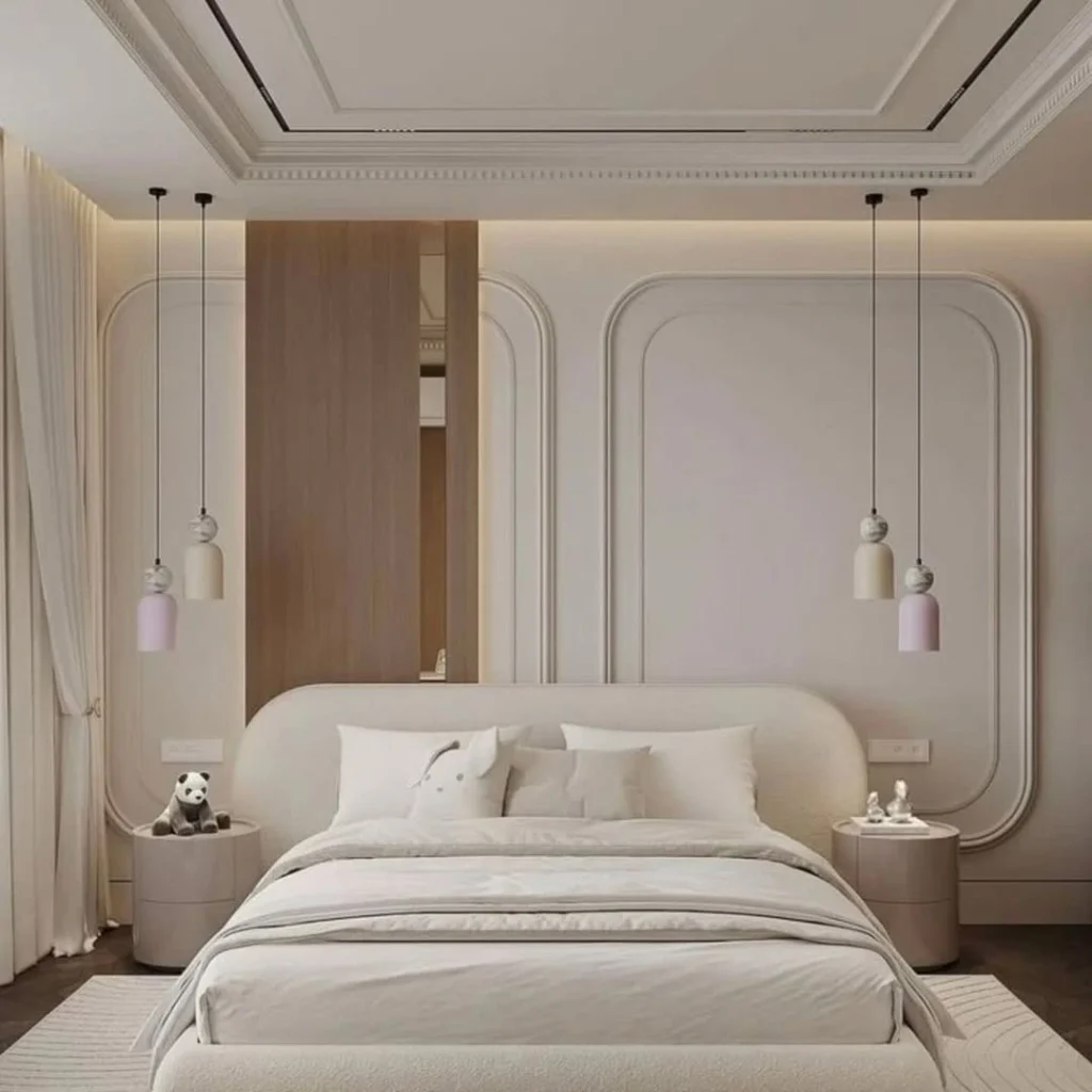 Modern bedroom with neutral wall art and layered lighting