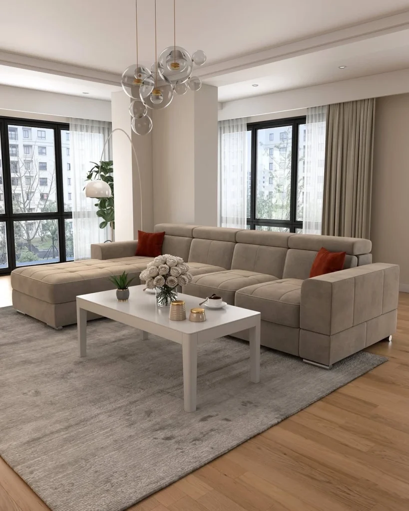 12 Elegant Living Room Decor Ideas for a Modern Home 11 Modern living room with large sectional sofa, neutral decor, and natural light
