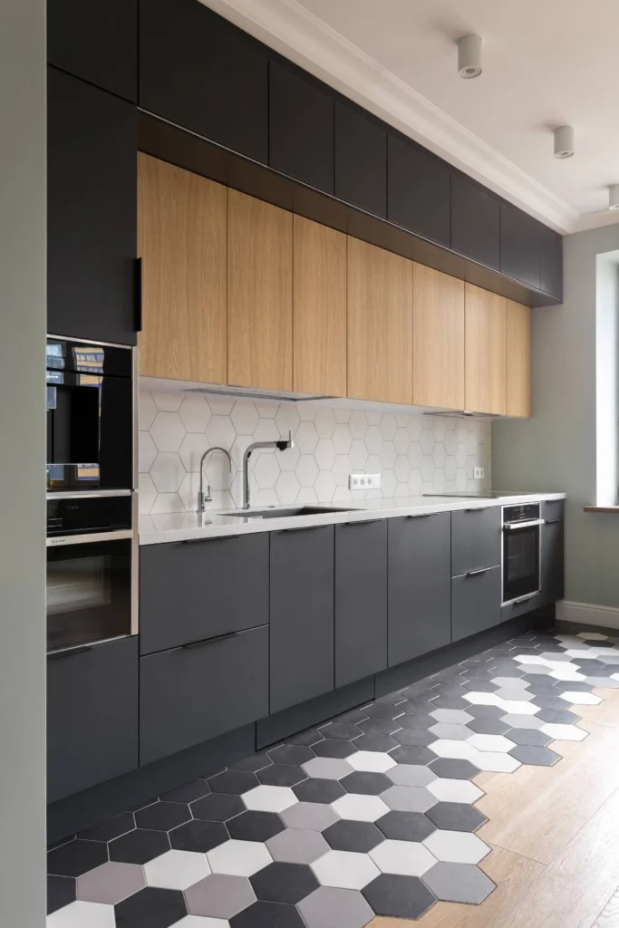 13+ Modern Kitchen Design Ideas for a Stylish and Functional Home 3 Two-tone modern kitchen cabinets with black and wood finishes and hexagon flooring