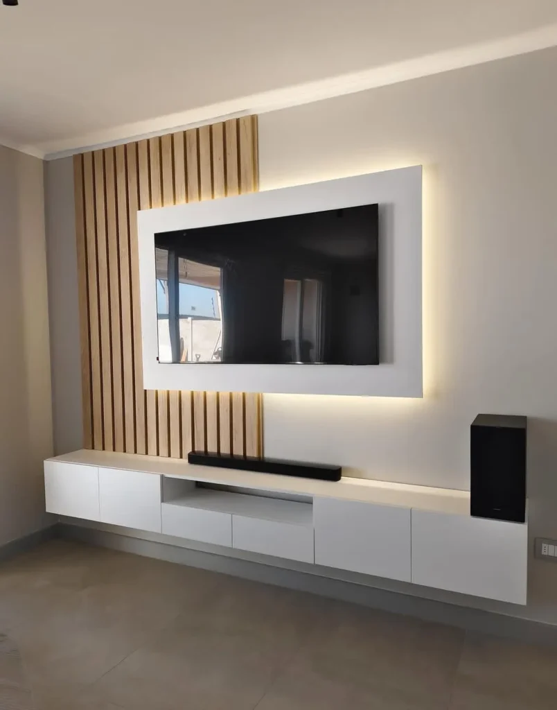 13 Modern Media Wall Ideas to Instantly Elevate Your Living Room 3 Minimal wooden media wall with floating shelves and TV