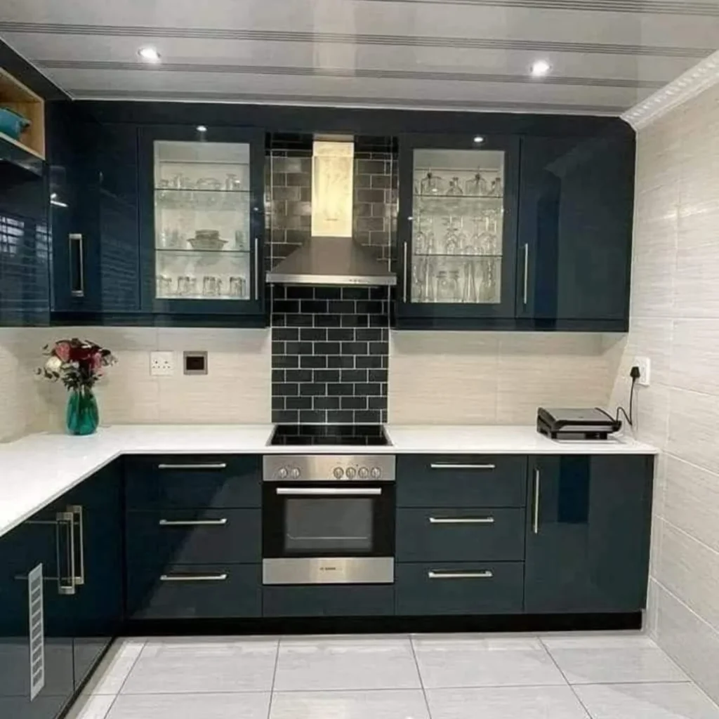 Dark modern kitchen with black cabinets and glass storage