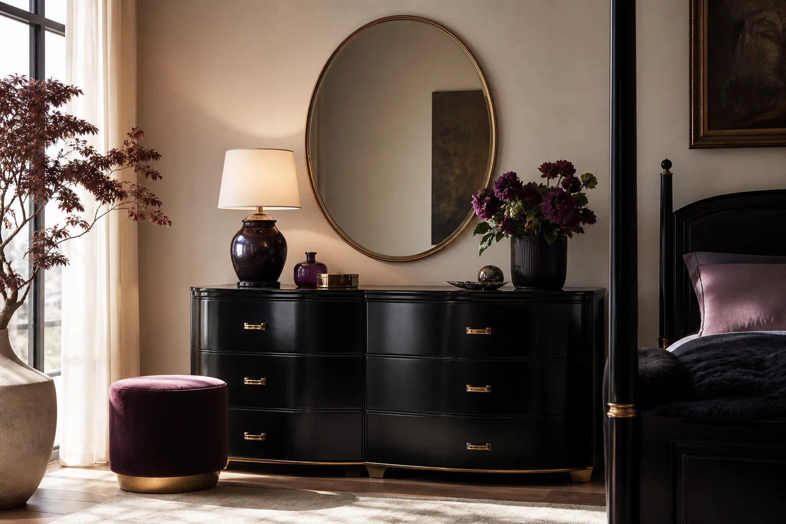 Elegant bedroom with a black lacquer dresser, curved brass hardware, oval mirror and jewel-tone decor